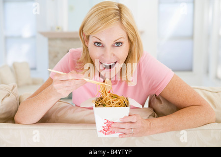 Woman Eating Meal With Chopsticks Stock Photo