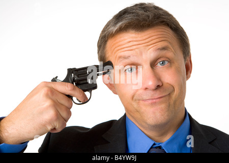 Businessman Holding Gun To Head Stock Photo