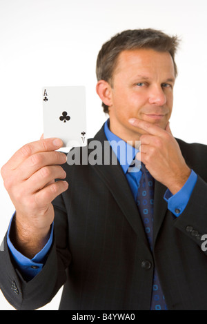 Businessman Holding The Ace Of Clubs Stock Photo