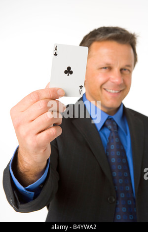 Businessman Holding The Ace Of Clubs Stock Photo