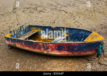 Old wrecked boat moored at beach in Maldon, England. Stock Photo