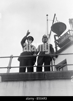 World's smallest police force - The five man Isle of Man harbour Police. Inspector Reginald Wood and Sgt, Benjamin Chapman on Douglas Harbour Control Bridge.;1949;018676/1 Stock Photo