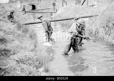 Dads Army ;Actor Clive Dunn who plays Corporal Jones Ian Lavender as pike , James Beck as Private Walker, in the BBC TV series Dads Army seen filming on location in Thetford Norfolk.;The cast were filming an assault course scene.;72 4866;©DM Stock Photo