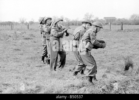 Dads Army ;Actor Clive Dunn who plays Corporal Jones Ian Lavender as pike ,Arnold Ridley as Godfrey, James Beck as Private Walker, John Laurie as Frasier in the BBC TV series Dads Army seen filming on location in Thetford Norfolk.;The cast were filming an assault course scene.;72 4866;©DM;Anglia Press for DM Stock Photo