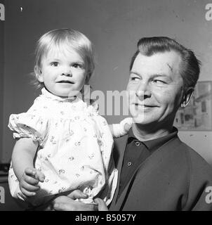The actor Clive Dunn who was loved by millions for his role as the somewhat befuddled and over eager Corporal Jones in the hit series Dads Army with his 18 month old daughter Polly March 1962 Stock Photo