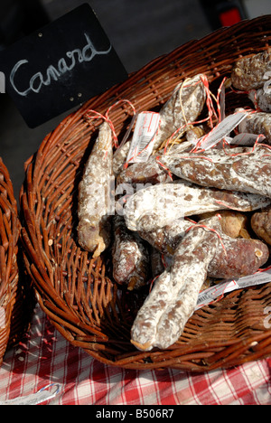 Stock photo of cured sausages for sale in a French market stall The sausages are made with local Duck Stock Photo