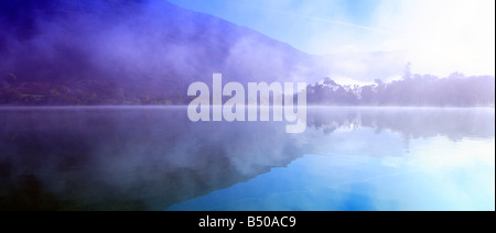 Early morning mist over Ullswater with reflection, Lake district, Cumbria Stock Photo