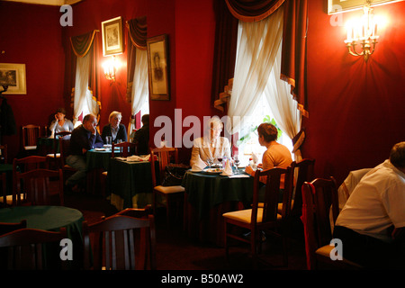 People sitting at the Literary Cafe St Petersburg Russia Stock Photo