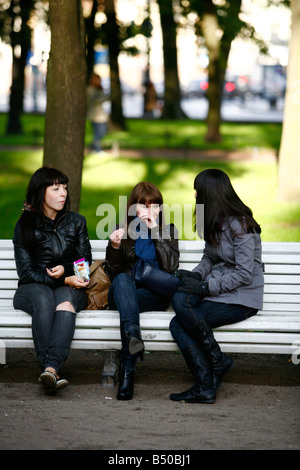 Aug 2008 - Young women sitting on a bench St Petersburg Russia Stock Photo