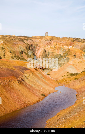 Mynydd Parys Mountain Ochre minerals in rocks at disused opencast copper mine. near Amlwch Anglesey North Wales UK Britain Stock Photo