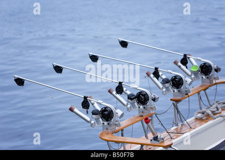 The fishing reel is mounted on a fishing rod for catching bream, carp,  roach and other peaceful fish. Tackle isolated on white background. File  contai Stock Photo - Alamy