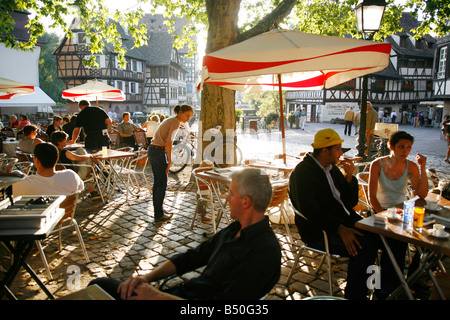 Sep 2008 - People sitting at an outdoors restaurant in Petite France Strasbourg Alsace France Stock Photo