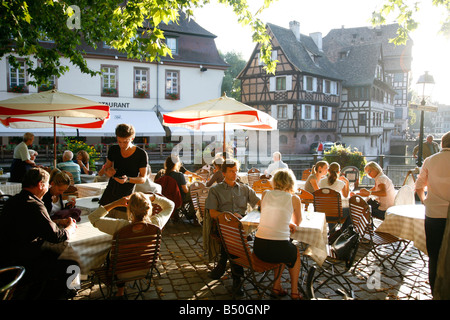 Sep 2008 People sitting at an outdoors restaurant in Petite France Strasbourg Alsace France Stock Photo