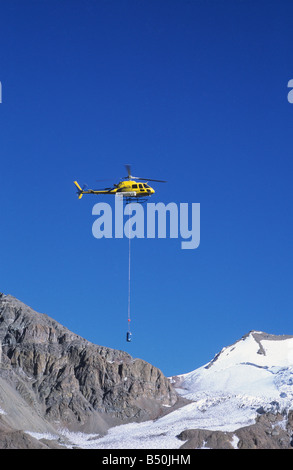 Helicopter removing latrine waste from Plaza de Mulas, base camp for Mt Aconcagua, Argentina Stock Photo