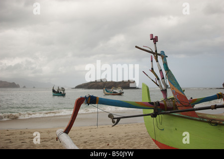 [fishing boats] anchor off [papuma beach] Stock Photo