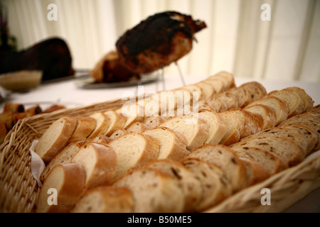 Selection of breads in a basket at a buffet Stock Photo