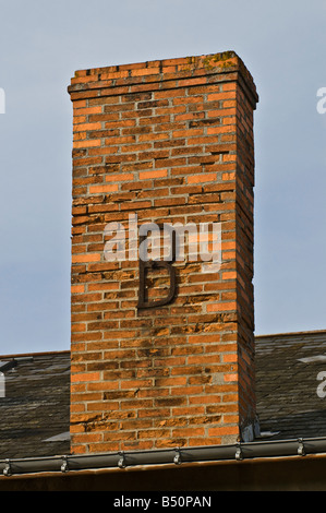 Decorative letter 'B' reinforcing chimney stack, France. Stock Photo