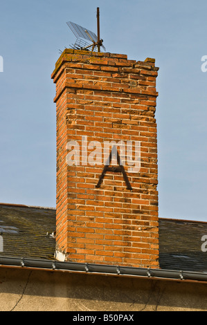 Decorative letter 'A' reinforcing chimney stack, France. Stock Photo