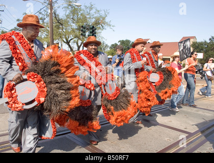 A New Orleans Social Aid & Pleasure Club marching in the Jazz Funeral of Michael P. Smith on Napoleon Ave. in New Orleans. Stock Photo