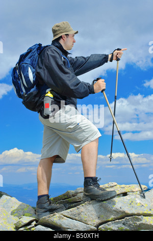 Climber on top of a mountain Stock Photo