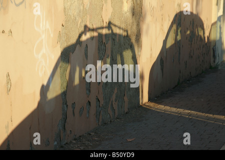 two cars shadow on wall in city Stock Photo