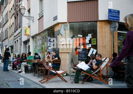 Sep 2008 - People sitting at an outdoors cafe on Grand Rue Strasbourg Alsace France Stock Photo