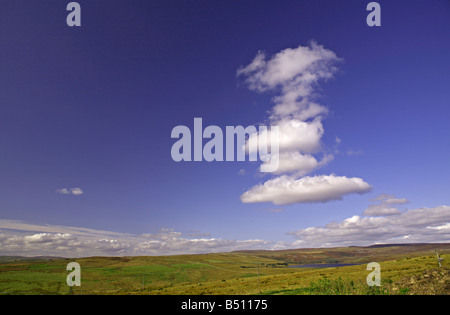 Cumulus clouds over Grimwith Reservoir near Hebden, North Yorkshire Viewed looking northwards from B6265 east of Dibbles Bridge Stock Photo