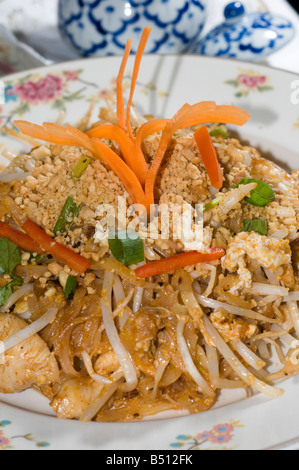 chicken pad thai food thailand stir fried noodles onion scallion bean sprouts and egg with crushed peanuts at thai restaurant Stock Photo