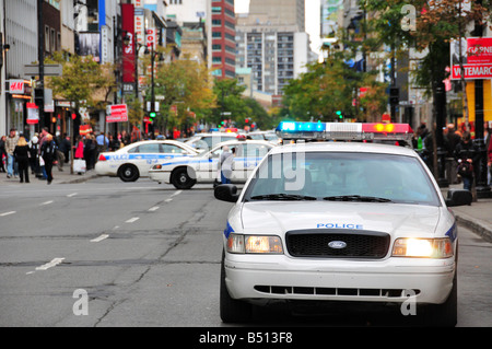 Police cars on St catherine street downtown Montreal Stock Photo