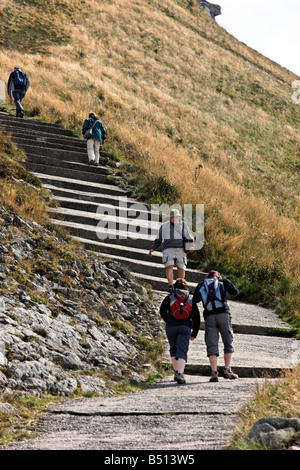 Tourists trek up and down the Puy Mary volcano, France Stock Photo