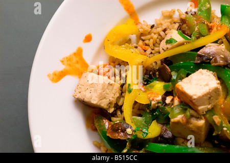 Tofu stir fry with vegetables on rice Stock Photo