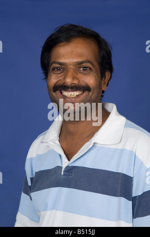 Portrait of a smiling middle aged Indian man Stock Photo