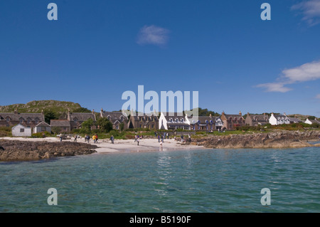 The Street in The Village on Iona and St Ronan's Bay seen from a boat on the Sound of Iona, Blue sky. Stock Photo