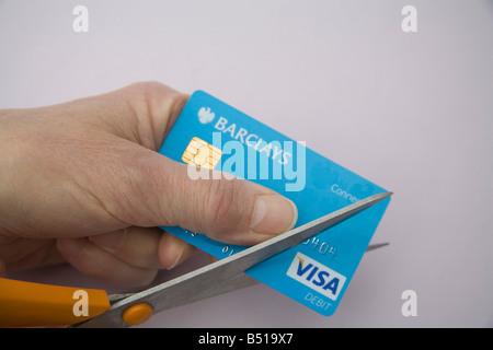 Studio Close up Cutting up a Barclays Connect debit card because account closed due to credit crunch Stock Photo