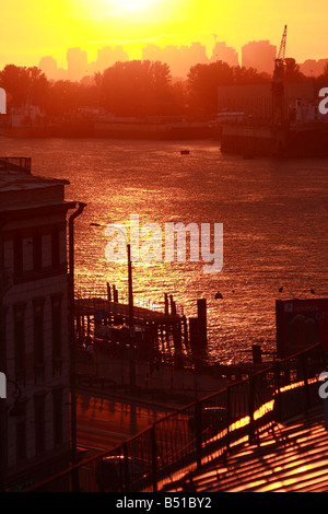 Bright sunlight reflection on Neva river in old town on summer sunset, St. Petersburg Stock Photo