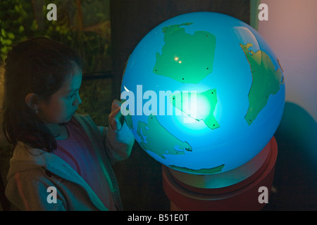 Child looking at globe at St Louis Science Center. Stock Photo
