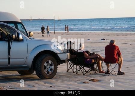 Relaxing in the late afternoon sun on Cable Beach Broome Western Australia Stock Photo