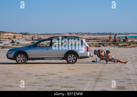 Relaxing in the late afternoon sun on Cable Beach Broome Western Australia Stock Photo