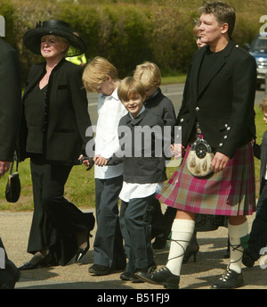 Caron Keating Funeral April 2004 St Peters Church in the grounds of Hever Castle in Kent Picture shows mother Gloria Hunniford children sons Charlie Lindsay Gabriel Lindsay husband Russ Lindsay Stock Photo