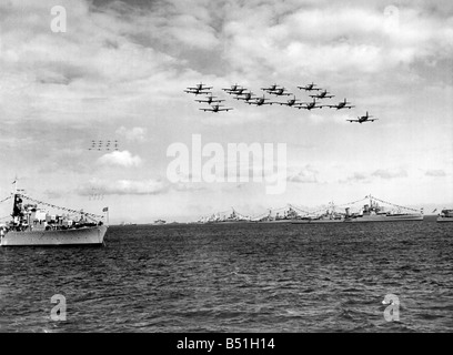 Royal Navy Fairey Firefly aircraft passing over the fleet during the fly past at Spithead by 300 Naval planes after the Queen had reviewed the ships as part of the Coronation celebrations. June 1953 P000114; Stock Photo