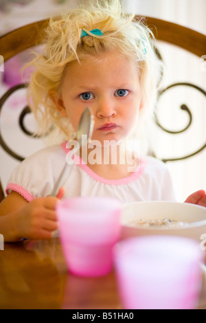 Girl Eating Breakfast Stock Photo