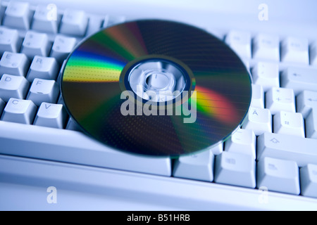 DVD on computer keyboard Stock Photo