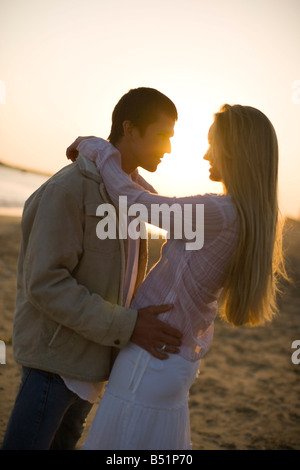 Couple on the Beach at Sunset, Corona del Mar, Newport Beach, California, USA Stock Photo