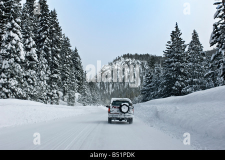 Car on Snowy Road Stock Photo