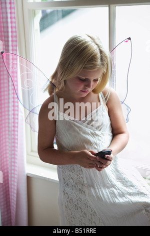 Young Girl Using Cell Phone Stock Photo