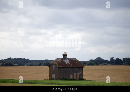 Boarded-up house, Felixstowe Ferry, Suffolk, UK. Stock Photo