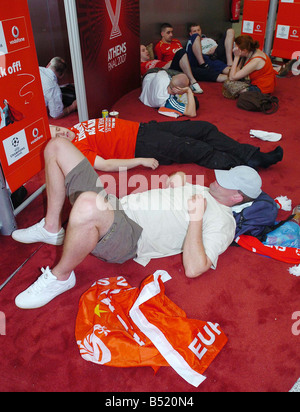 Sleepy Liverpool fans at Athens Airport after Champions league final in