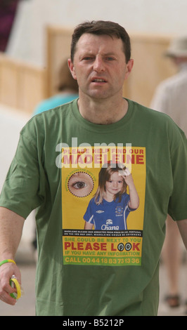 Abducted from her family s holiday apartment in Portugal on May 3 four year old Madeleine McCann is the subject of an international effort to return her safely to her parents arms Her parents gerry and kate take the couples other 2 children sean and amelie today from nursery geery is seen wearing a new campaign t shirt Stock Photo