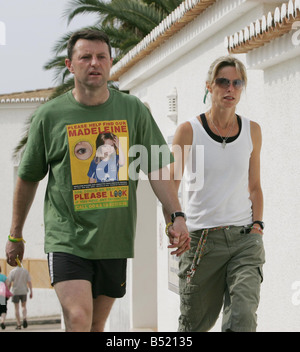 Abducted from her family s holiday apartment in Portugal on May 3 four year old Madeleine McCann is the subject of an international effort to return her safely to her parents arms Her parents gerry and kate take the couples other 2 children sean and amelie today from nursery geery is seen wearing a new campaign t shirt Stock Photo