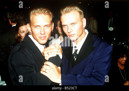 Matt Goss and brother Luke Goss April 1990 from the pop group Bros at the Ivor Novello Awards Ceremony in London Stock Photo